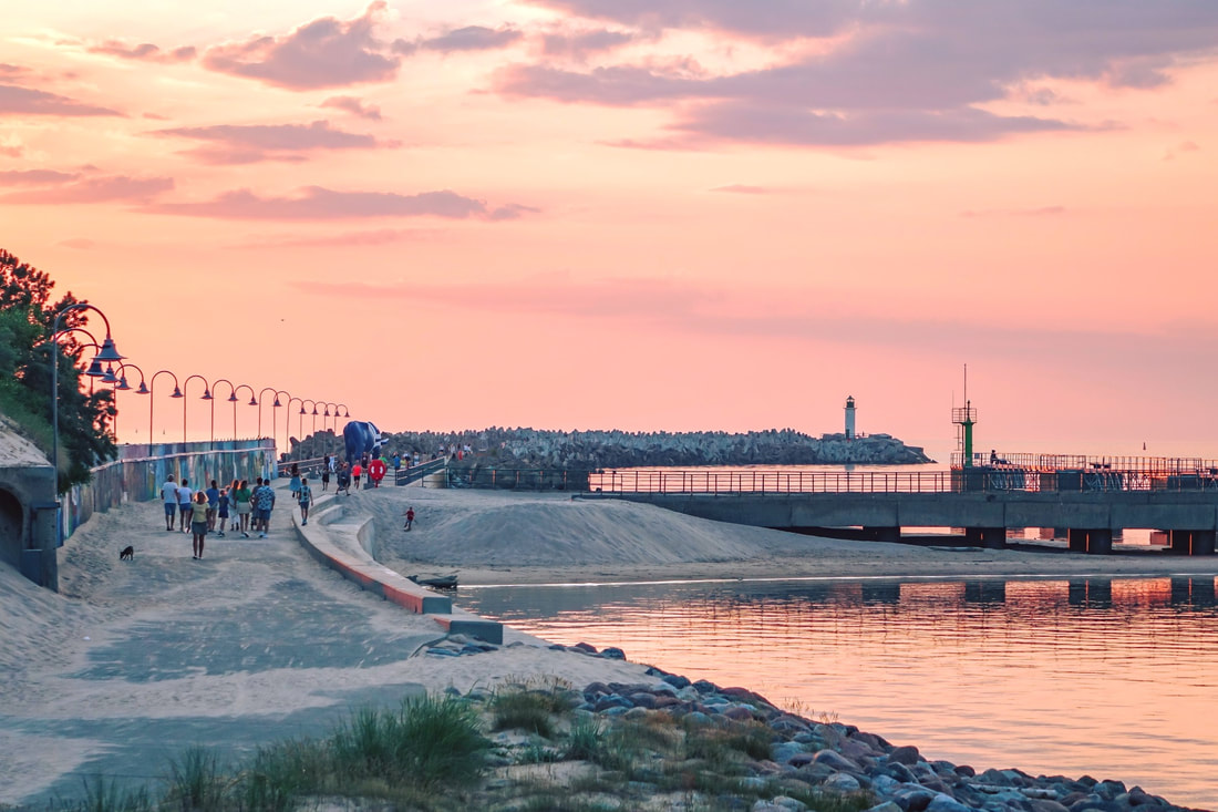 Southern Pier in Ventspils at sunset - popular promenade for pedestrians